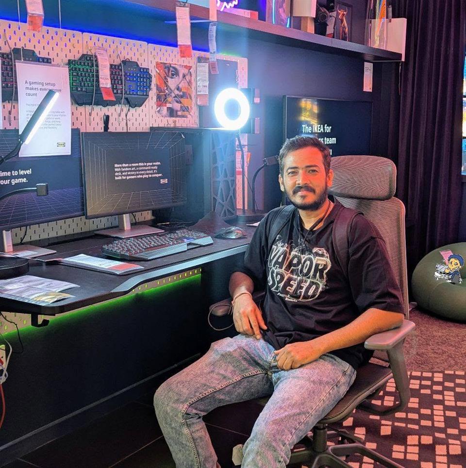Shubham Raj seated beside his development workspace
